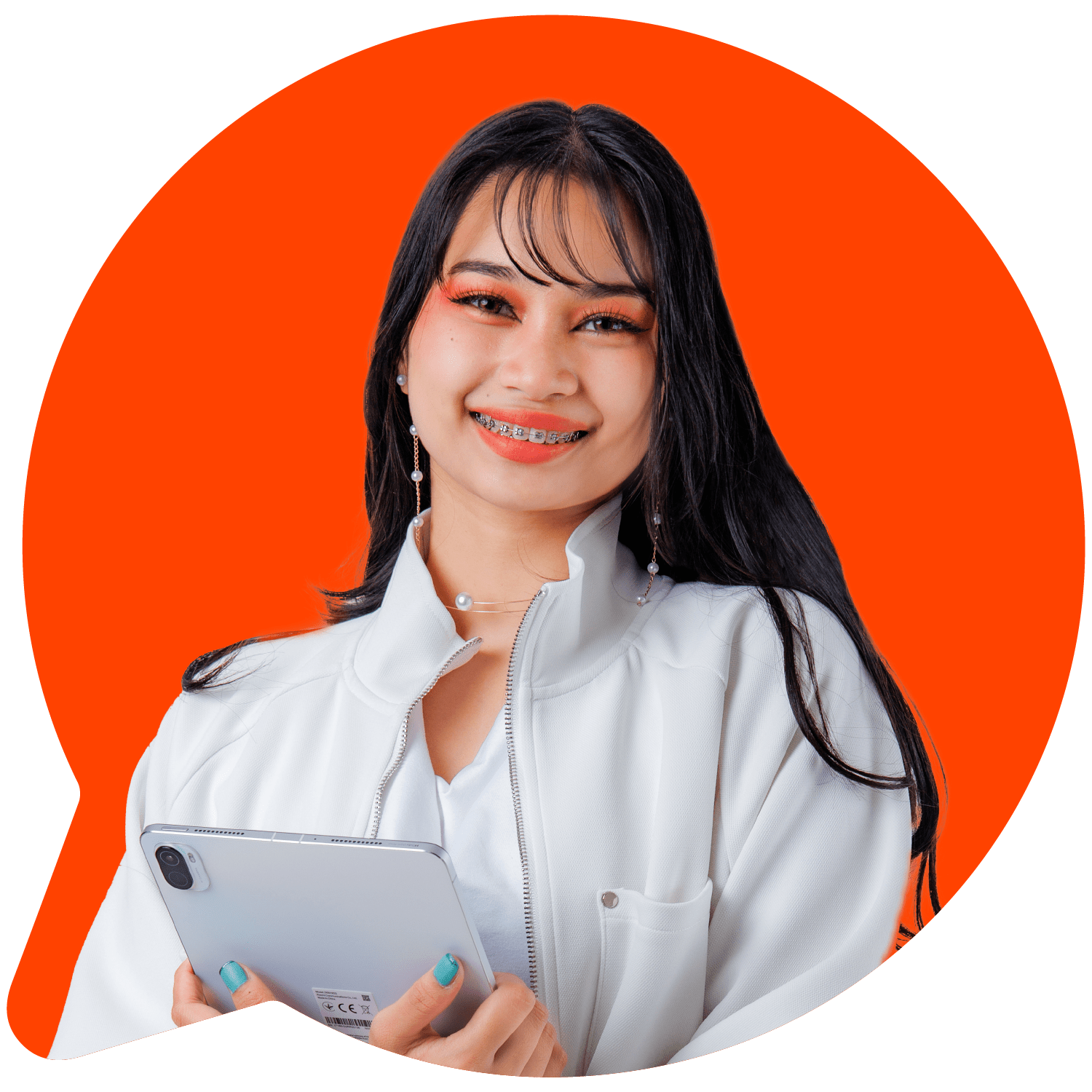 Woman holding tablet on orange background.