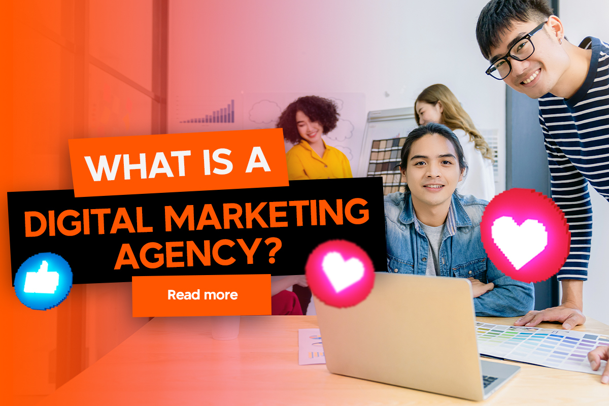 Three people work in an office with a laptop and color charts. The text on the image reads, "What is a digital marketing agency? Read more." Thumbs up and heart icons are also shown.